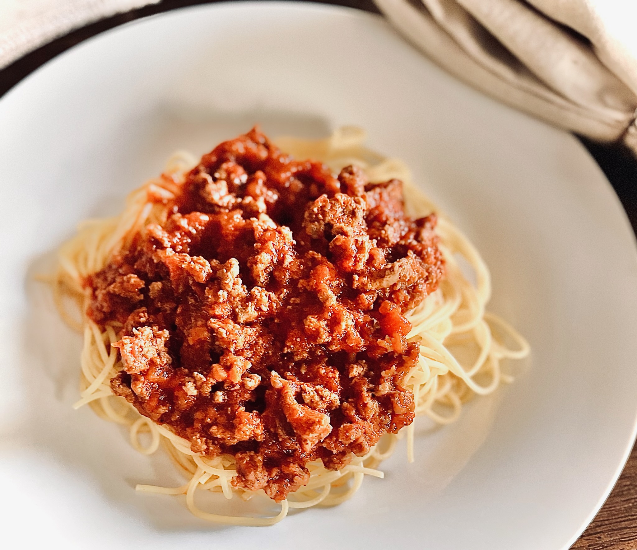 Picture of thin spaghetti noodles with ground beef and Raos Homemade Marinera Sauce.