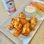 Picture of Buffalo Chicken wings with Kinders Buttery Buffalo Wing Sauce, homemade ranch and vegetables